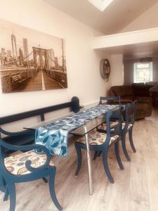 a dining room with a table and chairs at Station House in Ballina