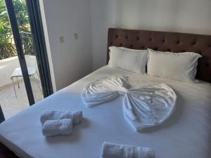 Postel nebo postele na pokoji v ubytování Sunset Aparthotel