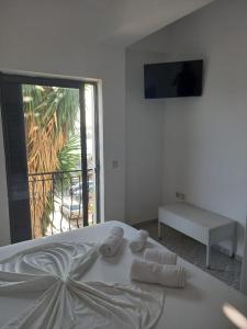 Postel nebo postele na pokoji v ubytování Sunset Aparthotel