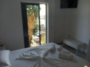 Postel nebo postele na pokoji v ubytování Sunset Aparthotel