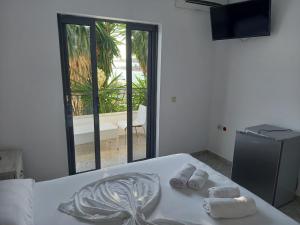 Postel nebo postele na pokoji v ubytování Sunset Aparthotel