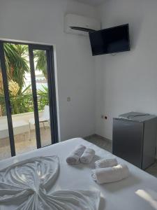 Postel nebo postele na pokoji v ubytování Sunset Aparthotel