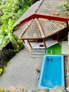 an aerial view of a house with a swimming pool at Sindu Grand Cabana Bentota in Bentota