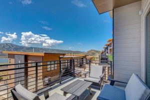 a balcony with chairs and a view of the mountains at On Top of the Mountains - Full Townhome in Keetley
