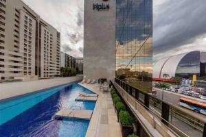 a swimming pool on the roof of a building at CULLINAN HOTEL premium flat de luxo apartamento 214 in Brasilia +3 photos