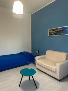 a living room with a couch and a table at CASA VACANZA BELVEDERE in Ercolano