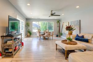 a living room with a couch and a table at Family Home with Pool about 7 Mi to Downtown Sacramento! in Sacramento
