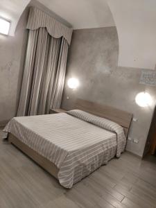 Ένα ή περισσότερα κρεβάτια σε δωμάτιο στο Hotel Antico Distretto