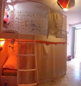 Postel nebo postele na pokoji v ubytování Ostello Exclusive Dependance