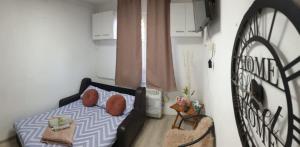 a small bedroom with a bed and a window at Matei Petra in Lugoj