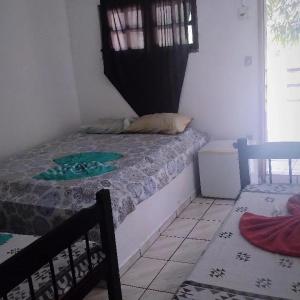 Ein Bett oder Betten in einem Zimmer der Unterkunft Beijaflor Pousada