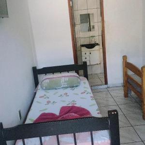 Postel nebo postele na pokoji v ubytování Beijaflor Pousada + 6 fotografií
