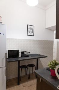 Kuchyňa alebo kuchynka v ubytovaní ClickTheFlat Aleje Niepodległości Center Apart Rooms + 10 fotografií