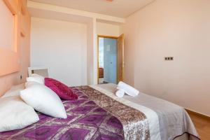 Voodi või voodid majutusasutuse Villa avec vue sur mer toas