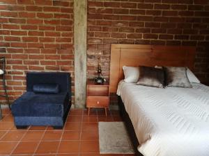 Postel nebo postele na pokoji v ubytování Casa y Flores