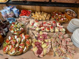 a table topped with lots of different types of food at Alva Pension 1 in Mikulov