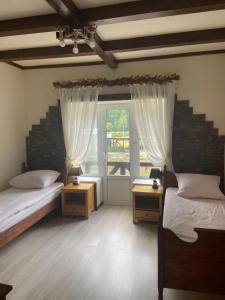 Postel nebo postele na pokoji v ubytování Hotel Tys