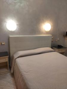 Ένα ή περισσότερα κρεβάτια σε δωμάτιο στο Hotel Antico Distretto