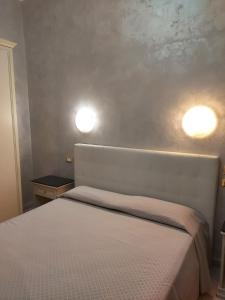 Ένα ή περισσότερα κρεβάτια σε δωμάτιο στο Hotel Antico Distretto