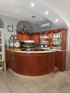 a bar in a restaurant with a counter at Hotel Antico Distretto in Turin