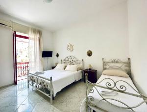 Ένα ή περισσότερα κρεβάτια σε δωμάτιο στο Family Relax Caracciolo