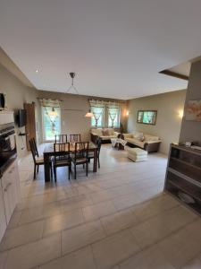 a kitchen and living room with a table and chairs at Ahr-Weinbergblick in Bad Neuenahr-Ahrweiler