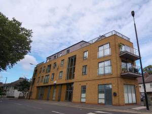 a large brick building on a city street at Perfect 1 bed flat in London