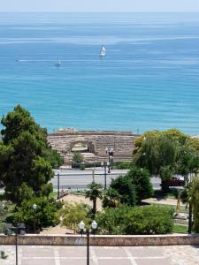a view of the ocean with a boat in the water at Casa Pretori in Tarragona