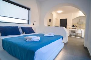 a bedroom with a bed with towels on it at Shape-Meander in Kalymnos