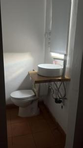 a bathroom with a sink and a toilet at Paradise Villa for 6 at Odemira River&Country in Santa Clara-a-Velha