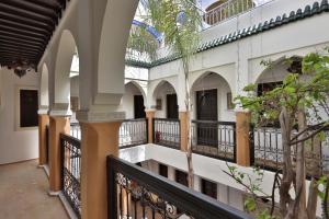 a corridor of a building with a balcony at Riad 22 - L'Etoile d'Orient in Marrakech