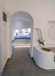 a bedroom with a bed and a table in a room at Shape-Spiral in Kalymnos