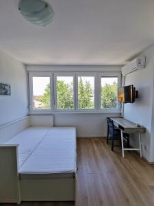 En eller flere senge i et værelse på Apartment Luna in Biograd center