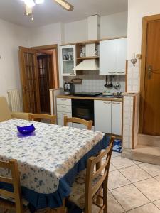 a kitchen with a table with a blue bowl on it at La Libellula in Ortona