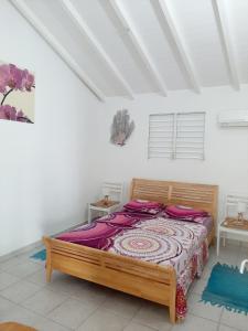 Postel nebo postele na pokoji v ubytování Flamboyant