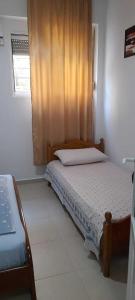 Cama o camas de una habitación en Sanos GardenApartament