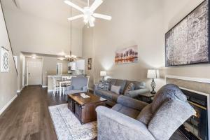 a living room with a couch and a fireplace at Gorgeous 3 Bed 3 Bath Pointe Royale Condo Branson MO in Branson