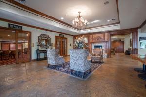a large lobby with chairs and a chandelier at Gorgeous 3 Bed 3 Bath Pointe Royale Condo Branson MO in Branson