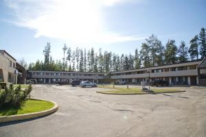 an empty parking lot in front of a building at Canadas Best Value Inn Whitecourt in Whitecourt