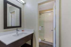 a bathroom with a sink and a shower at Econo Lodge Cherry Point in Havelock