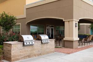 two grill backs on the side of a building at Homewood Suites Odessa in Odessa