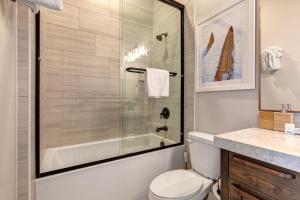 a bathroom with a shower and a toilet and a sink at On Top of the Mountains - Unit A in Keetley +14 photos