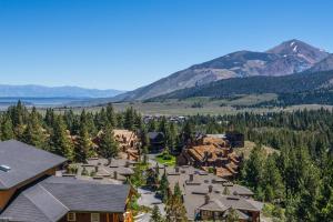an aerial view of a resort with trees and mountains at Eagle Run # 204 in Mammoth Lakes