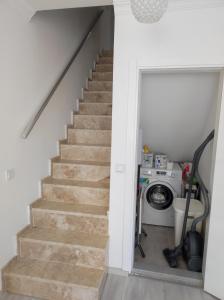 a staircase in a house with a washing machine at Elif home in Kas