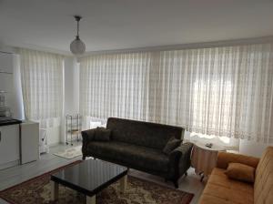 a living room with a couch and a table at Elif home in Kas