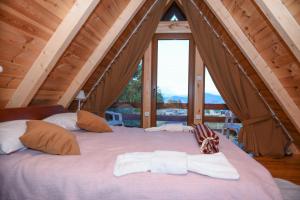 En eller flere senge i et værelse på Highlander guesthouse