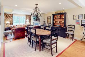 a dining room with a table and chairs at Village Green Unit 14E in Stowe