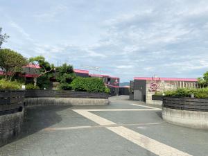 a parking lot in front of a building at YOL in Saijo