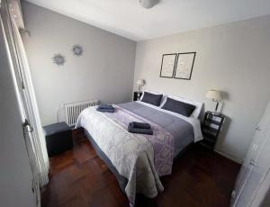 En eller flere senge i et værelse på Mendoza Your Apart