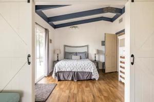 a bedroom with a bed and a blue ceiling at Black Bear Suite Hot Tub Sleeps 4 affordable in Oakhurst